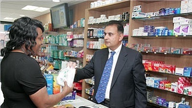 A woman in consultation with a pharmacist at a pharmacy