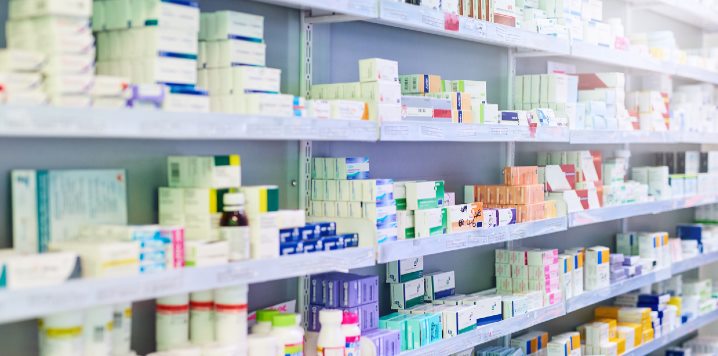 Pharmacy shelves stocked with medication